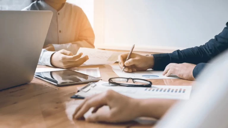 CPA and financial advisor working side by side reviewing a client collaboration strategy