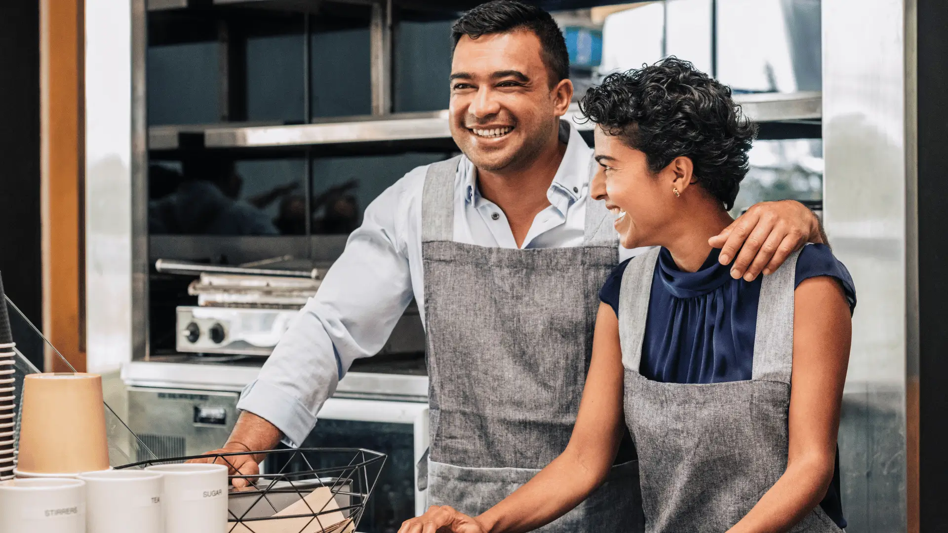 Successful small business owners working together in their restaurant