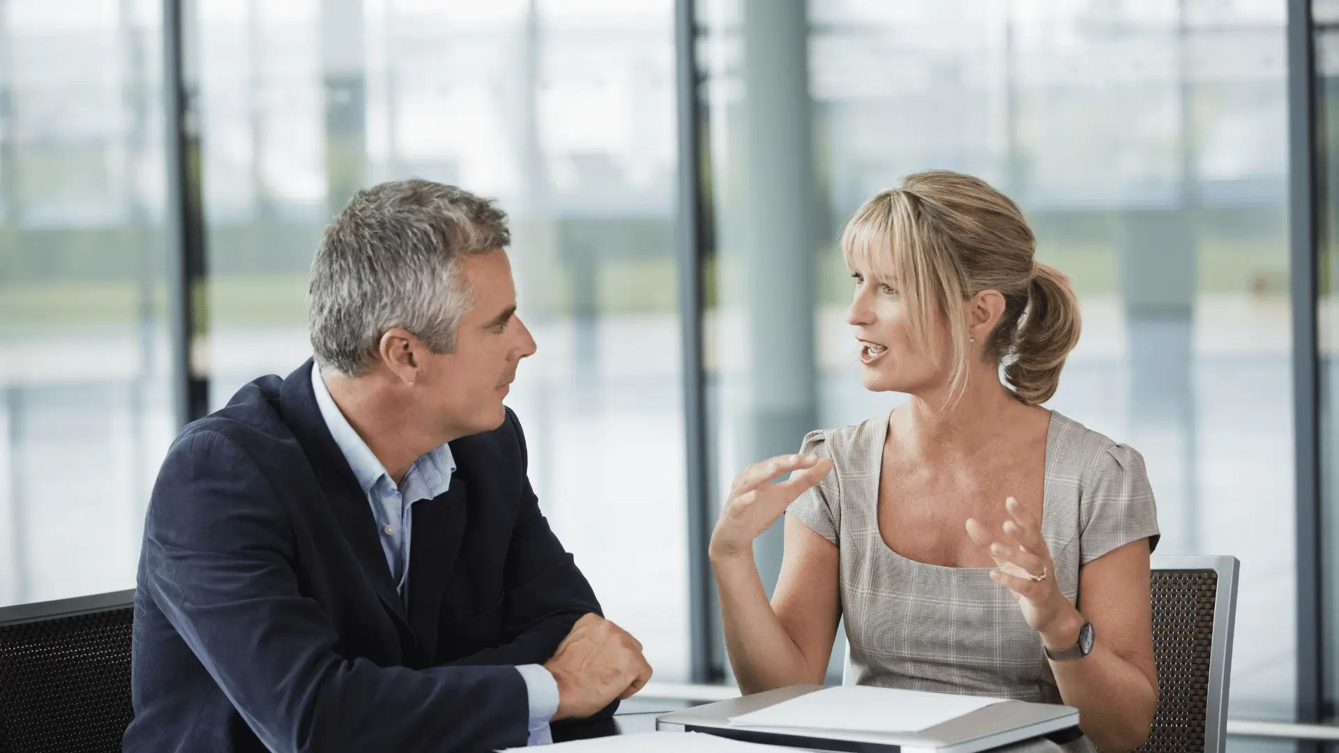 Financial advisor in focused business planning discussion with client
