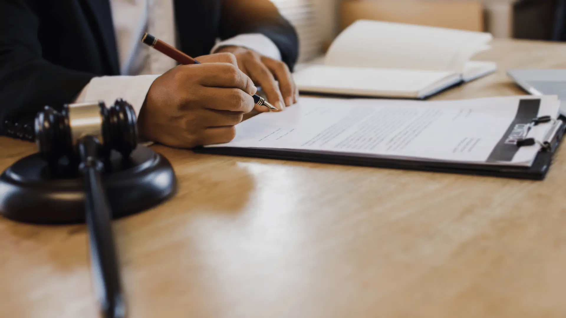 Attorney and business owner signing business succession planning agreement