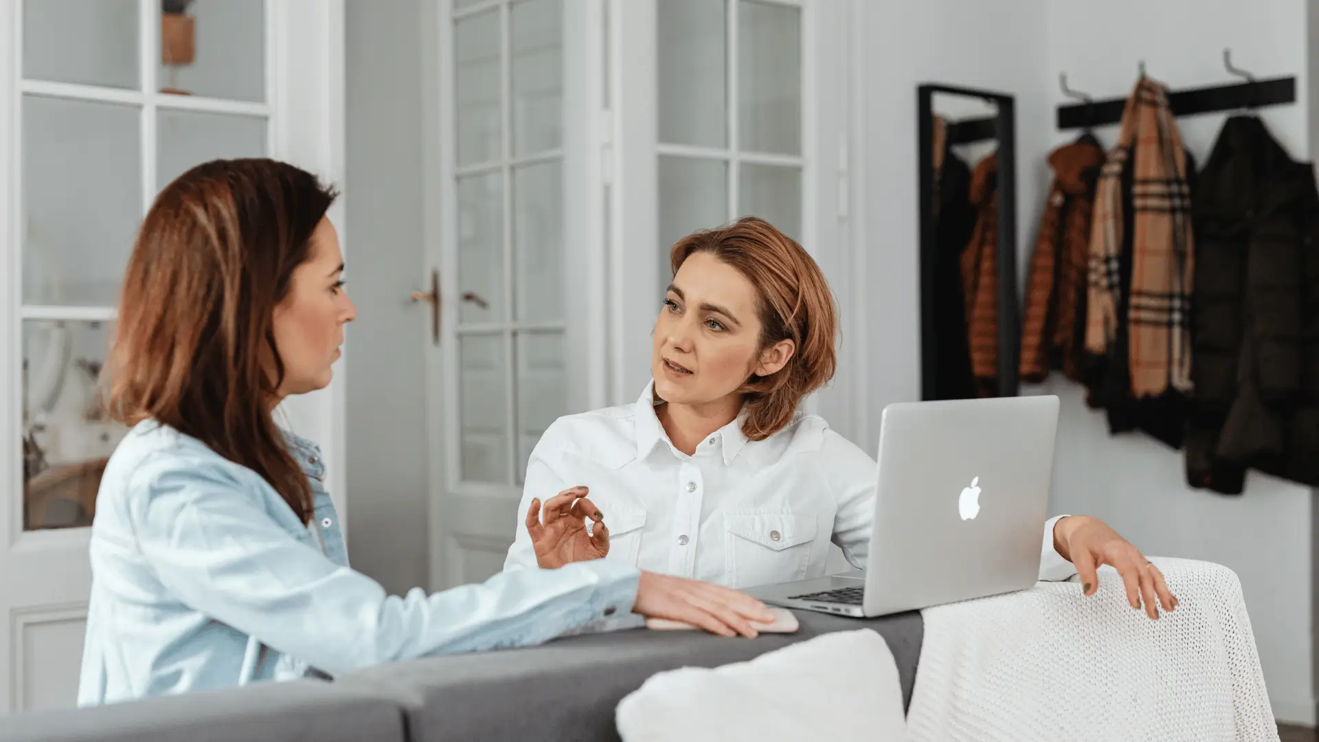 Financial advisor and client in focused planning discussion at home office
