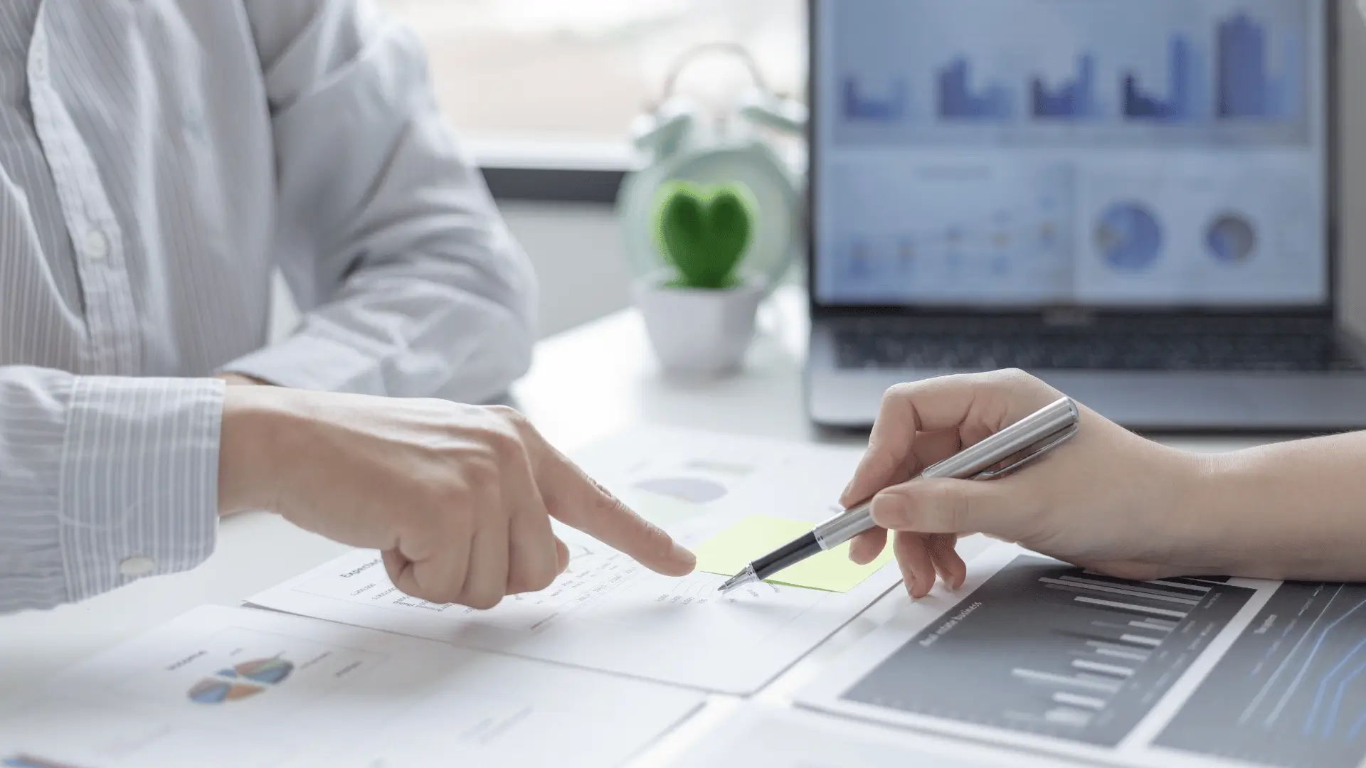 CPA and advisor reviewing tax planning strategy and financial documents
